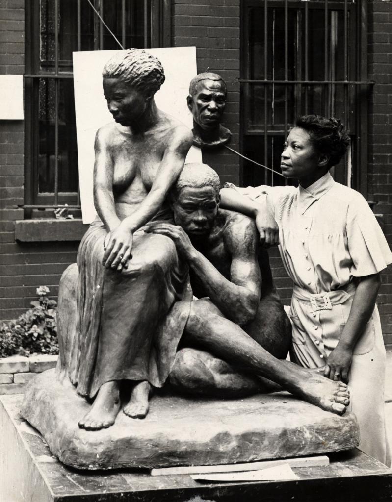"Augusta Savage posing with her sculpture Realization”, New-York, 1938.
