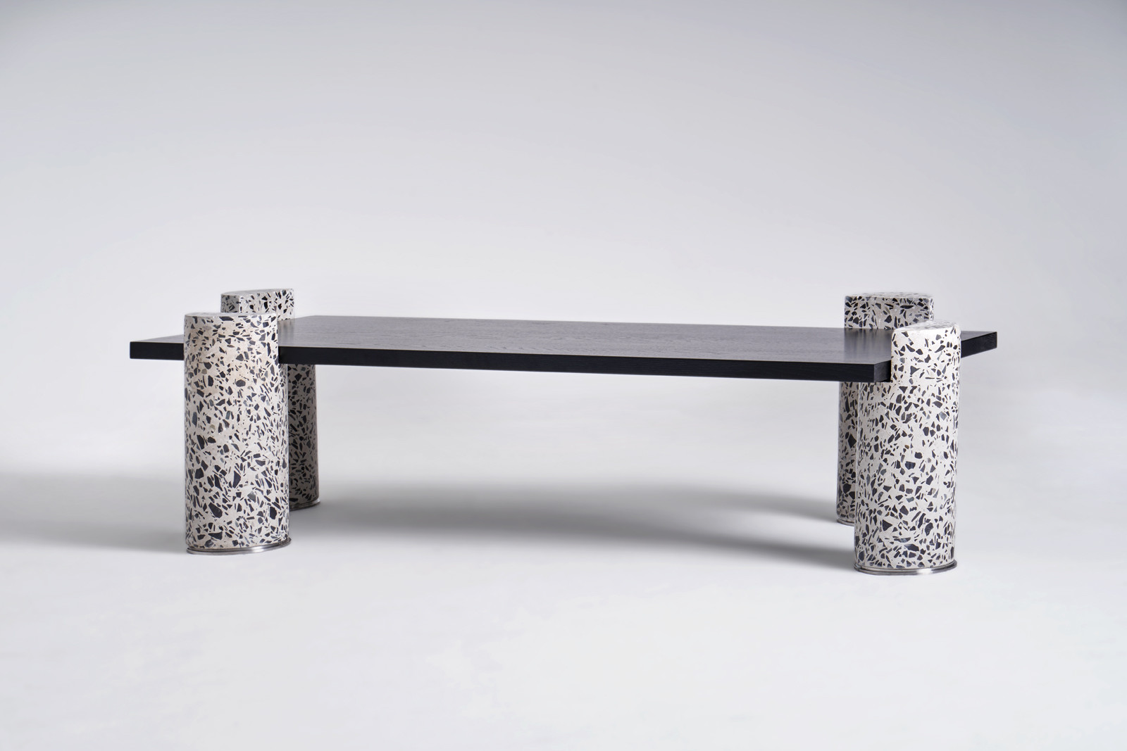 Ledge,2019. Coffee table. Limited edition. H 14.97 in. x W 23.63 in. x D 63 in. H 38 cm x W 60 cm x D 160 cm Concret, Stainless Steel, Ebonized Oak © Oliver Whyte